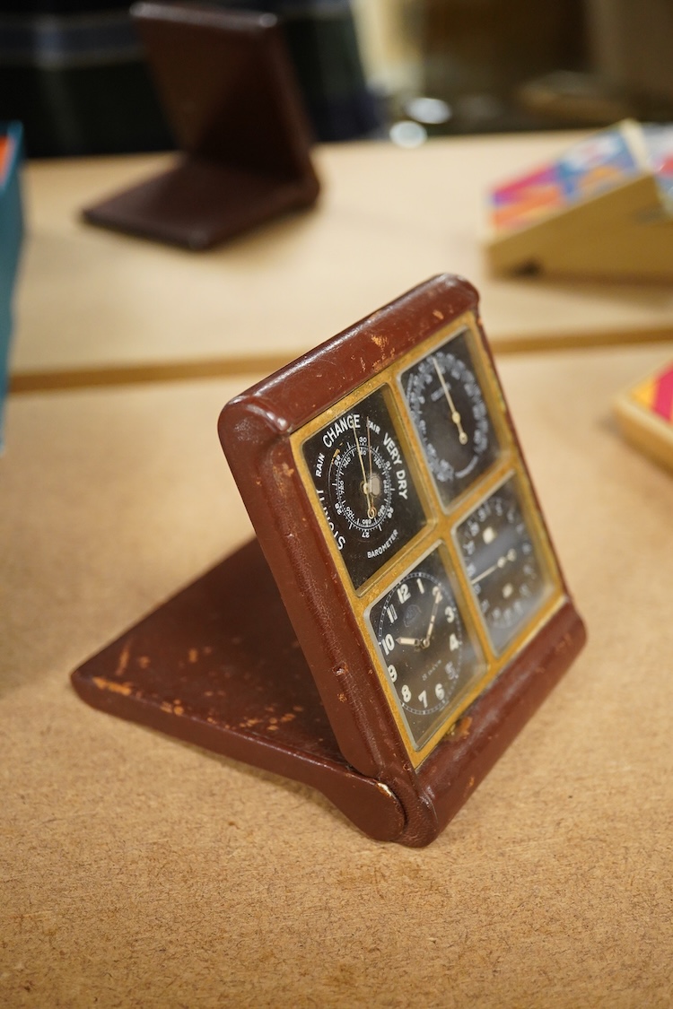 A mid-century Swiss leather cased travelling timepiece compendium with barometer, calendar and thermometer retailed by Ross, 10cm h